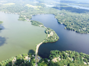 This aerial photograph of East and West Monponsett ponds was taken by Halifax Police Chief Ted Broderick.  It dramatically shows the harm drawing down water from the ponds has done.  According to the law passed in 1964 to allow Brockton to take the Monponsett water as an “emergency measure”, Brockton must pay to maintain the ponds if they draw water from the ponds.    