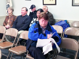 Halifax Animal Control Officer Noreen Callahan carefully reviews her notes prior to a Dog Hearing held before the Board of Selectmen. Photo by Abram Neal.