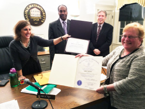 Debra Tinkham poses with the Halifax Board of Selectmen and her two certificates of appreciation for her 27 years of service on the Town’s Zoning Board. Photo by Abrahm Neal.