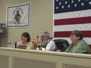 The Plympton Board of Selectmen, from left, Christine Joy, Chairman Mark Russo and Colleen Thompson listen carefully to residents as they express their opinions at a forum on Jan. 25 regarding a proposed medical marijuana ‘grow-op’ on Ring Road. Photo by Abram Neal